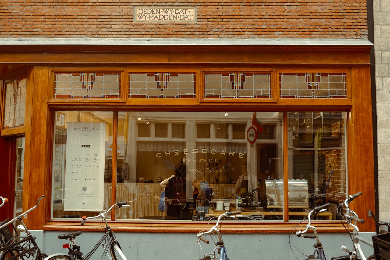 Explore the quaint charm of a cheesecake shop front in Amsterdams historic streets.